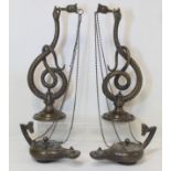 Pair of late 19th Century / early 20th Century bronze wall lights in the form of Roman oil lamps