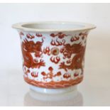 Small Chinese "Rouge de Fer" jardiniere or fern pot, decorated with dragons chasing flaming pearl.