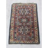 Turkish wool rug with polychrome geometric medallions. 163cm x 104cm.