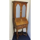 Early 18th century and later bureau bookcase of small proportions, two mirror doors to the upper