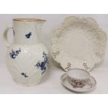 Large 18th century Worcester porcelain jug with moulded leaf body, mask spout and blue floral and