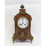 French mantel clock in the manner of Boulle with enamel dial and anchor movement, the brass inlaid