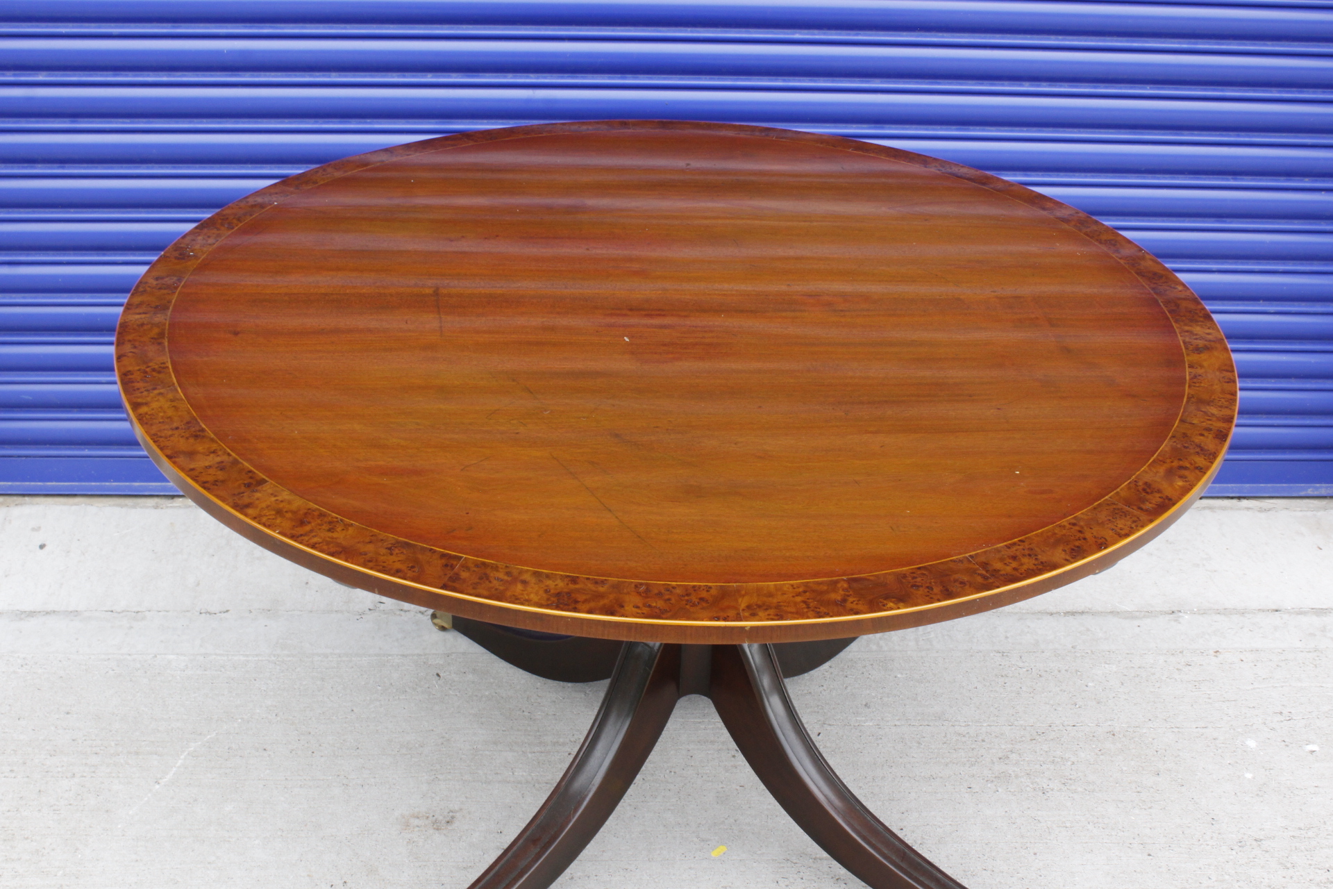 19th century circular mahogany crossbanded tilt top breakfast table, raised on turned column,