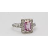 18ct white gold pink sapphire and diamond ring of rectangular form with diamond set shoulders. PS