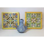 Victorian majolica square tiles, one with pierced Fleur de Lys the other with stylised flowerhead