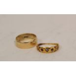 Two 18ct gold rings (6.6g).