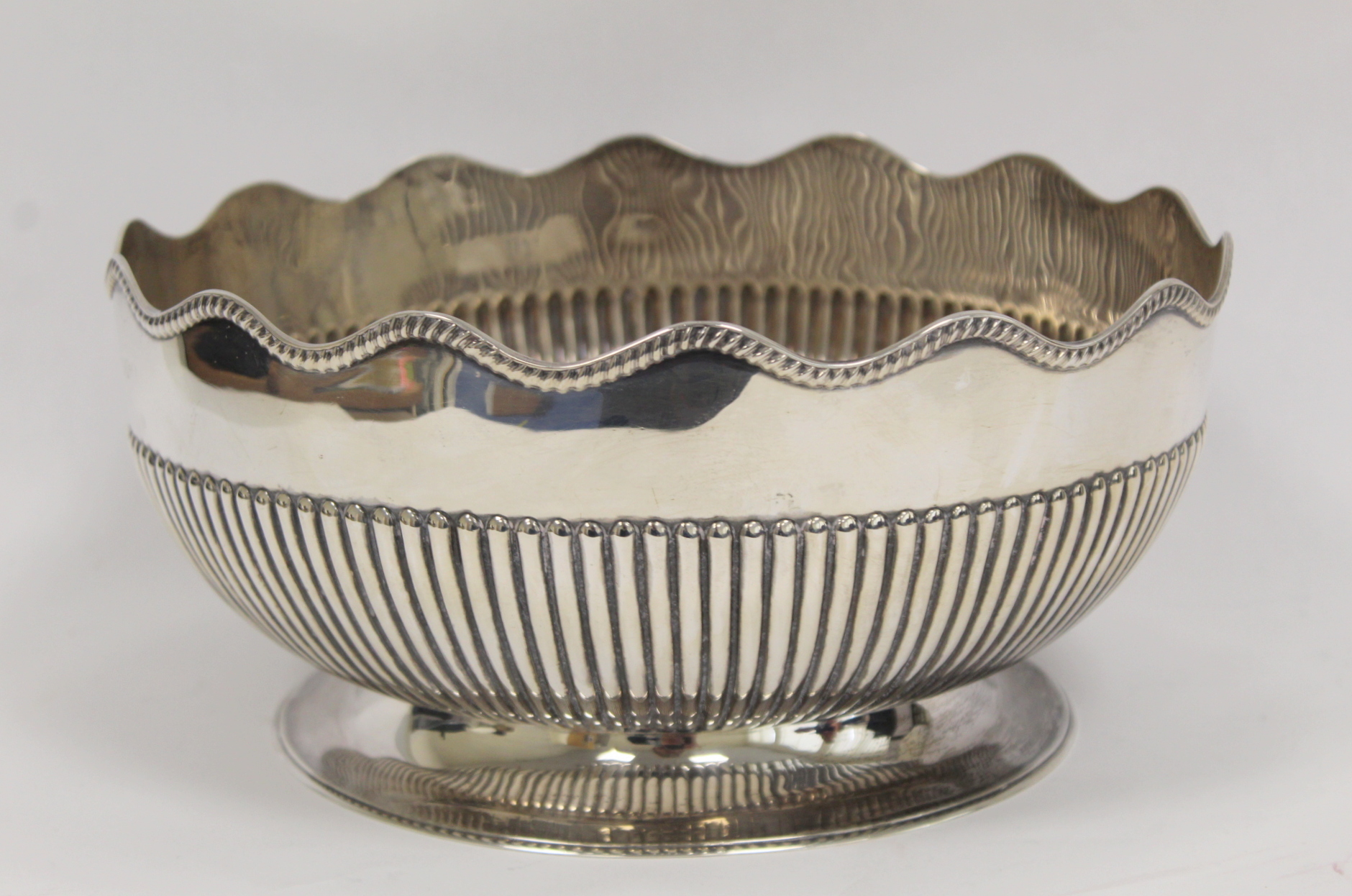 Silver rose or punch bowl, part fluted with waved gadrooned border on spreading foot, by Martin &