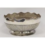 Silver rose or punch bowl, part fluted with waved gadrooned border on spreading foot, by Martin &