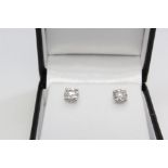 Pair of white gold solitaire diamond studs. 1.33ct , boxed
