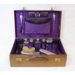 Ladies leather travel case by Finnigans, Manchester and Liverpool containing six silver topped jars,