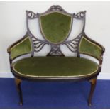 Edwardian mahogany inlaid tub sofa the upholstered shield shaped back flanked by pierced panels,