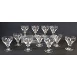 Set of eleven 19th century clear glass rummers, the pan top bowls on annular knop, short tapered