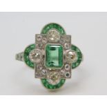 Art Deco style Platinum emerald and diamond cluster ring, the central emerald surrounded by diamonds