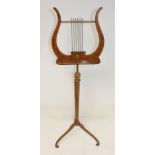 19th century adjustable painted satinwood music stand, the book rest of lyre shape, on turned column