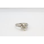 Platinum set old cut solitaire diamond ring with diamond set shoulder. old cut diamond 2.34ct