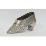 Silver box modelled as a shoe embossed with scrolls, apparently unmarked, probably Dutch c1900, 20cm