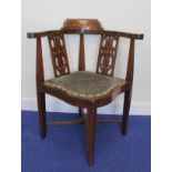 Edwardian inlaid mahogany corner chair on square tapered supports.