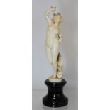 19th century European carved ivory figure of a bacchanalian female deity, probably Libera, with wine