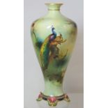 Royal Worcester James Hadley porcelain vase of baluster form on four scroll feet decorated with