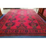 Large Turkish wool on wool carpet, the tomato red field with three rows of five hooked