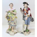 Pair of Continental porcelain figures of a girl with a basket of fruit and a boy with pipe and