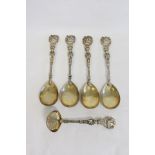 Set of silver gilt fruit spoons and sifter of embossed and pierced renaissance style by Charles