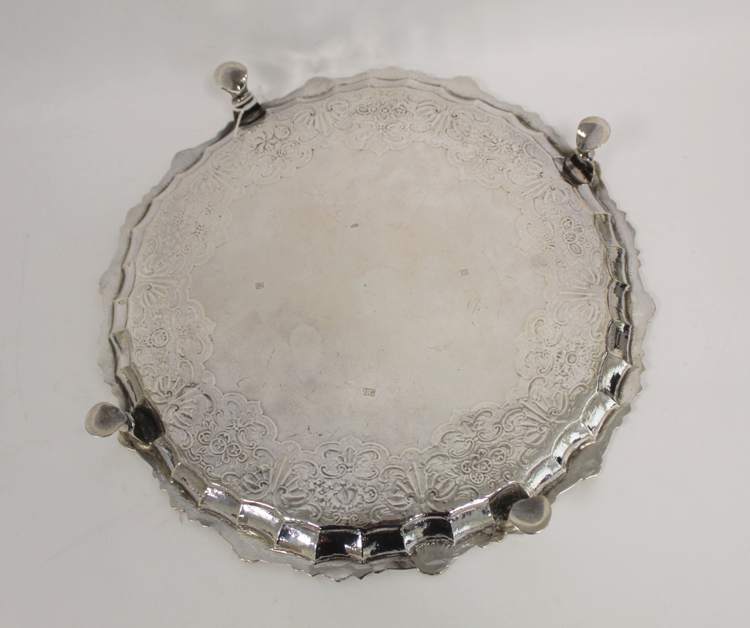 Silver circular tray with shaped moulded and scallop border, embossed with scrolls, flowers and - Image 2 of 4