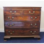 Georgian mahogany bachelor chest with brushing slide over two short and three long drawers, on