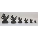 Graduated set of six Chinese bronze opium weights in the form of Mandarin Ducks, the largest 6.5cm