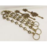 Set of four Victorian brass curtain tiebacks of chain link form, each 64cm long; also a pair of