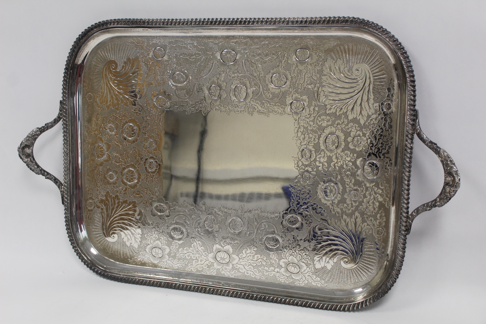 Good late Victorian silver tea tray, rectangular with rounded corners, embossed scrolls, flowers and - Image 2 of 4