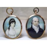 A pair of Georgian portrait miniatures of a husband and wife, each watercolour on ivory, 8cm x