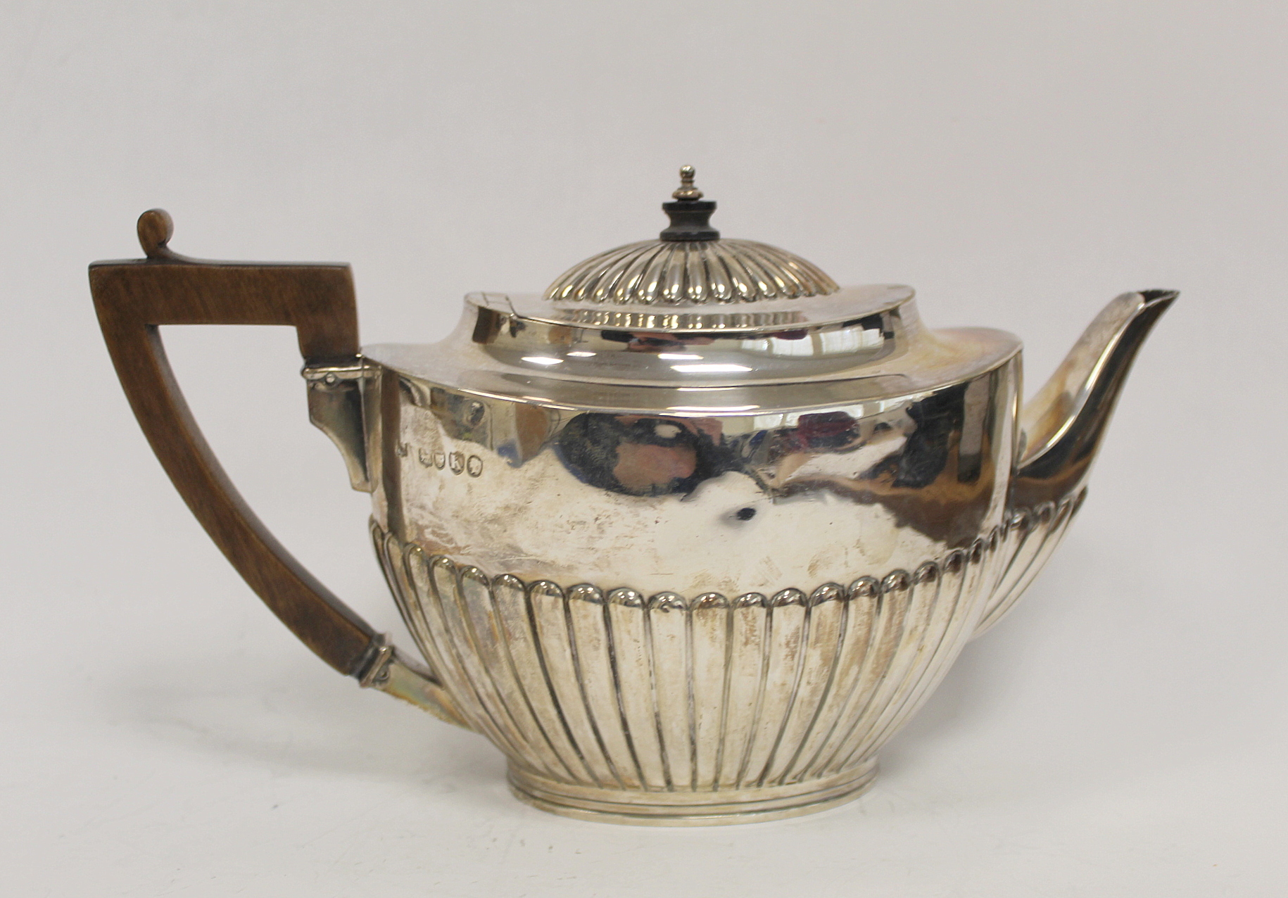 Silver tea pot, oval part fluted, by E. Hutton 1885, 18 oz / 500g.