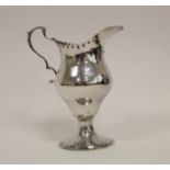 Silver cream jug of bellied shape, with punch beaded edge on spreading foot, makers mark not clear