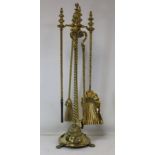 Regency brass fire stand with shovel, brush, poker and tongs with knopped wrythen twist handles