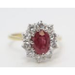 18ct gold oval ruby and diamond cluster ring. Diamonds 1,00ct approx ruby 1.50ct approx