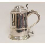 Silver tankard of tapering shape with moulded domed cover, girdle and spreading foot, initialled and