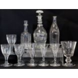 Antique small glass decanter of moulded mallet form with ringed neck and pronounced domed base,