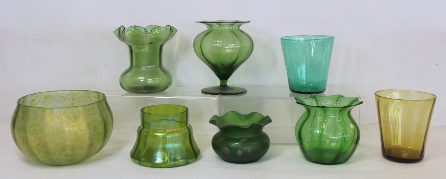 Early 20th century art glass mottled green lustre bowl with internal vertical ribbing, 11cm high;