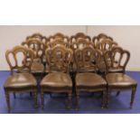 Set of twelve Victorian dining chairs, each with stuff over seat on reeded supports