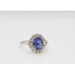 18ct white gold and sapphire diamond cluster ring. Sapphire 1.85ct approx, Diamonds 0.51ct, boxed