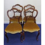 Set of four Victorian mahogany balloon back salon chairs with carved cresting, stuff over seats