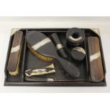 1920's silver mounted ebony dressing table set comprising; three covered boxes, a hair brush