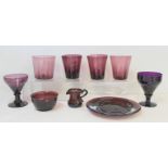 Nine pieces of Victorian and later amethyst glass comprising: two rummers with funnel shaped
