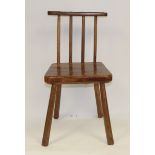 19th century primitive ash child's chair, the comb back to a tapering seat with canted corners on