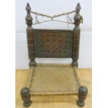 North West Frontier/North Pakistan tribal low chair with carved back, gut string seat and crossed