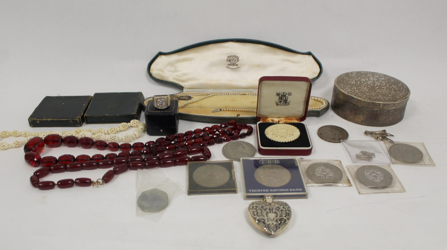 Silver circular box '800', various coins, beads and other items.