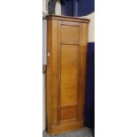19th century pine tall corner cabinet, the panelled door enclosing shelves on plinth base.