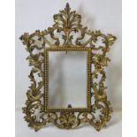 Antique gilt copper pierced foliated scroll photograph frame with folding scroll stand to fit