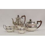 Silver four piece tea and coffee set, boat shaped with gadrooned edges on bun feet, by Mappin &